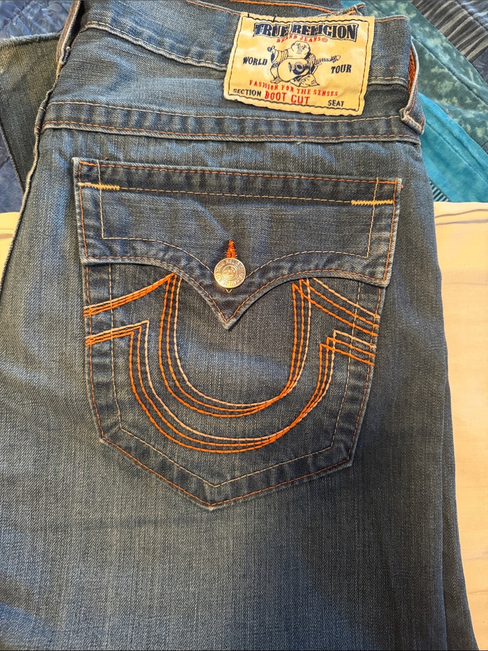 True Religion Women’s Boot Cut Jeans in Medium Blue with Orange Stitching